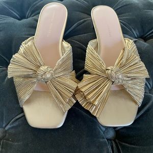 Barley worn Loeffler Randall gold flat slides w/bow